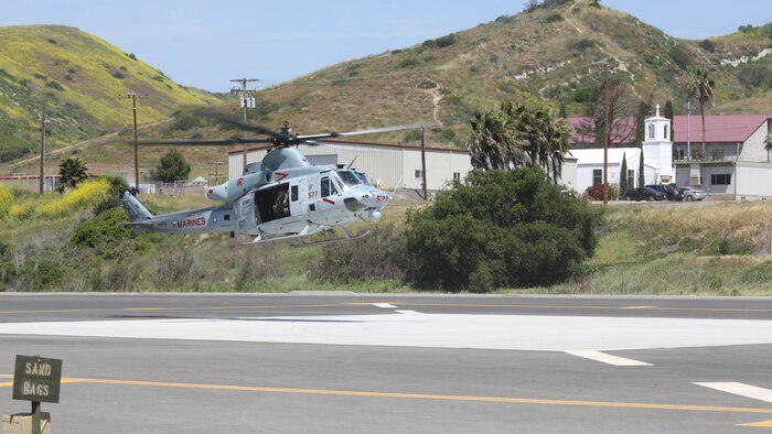 A UH-1Y Huey with Marine Light Attack Helicopter Training Squadron 303 lands during a demonstration for the School of Infantry West at Marine Corps Base Camp Pendleton, Calif., April 11. Marines with HMLAT-303 conducted basic flight maneuvers during the demonstration to build cohesion between air and ground Marines. 
