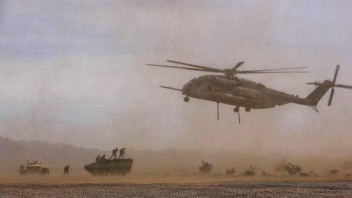 Marines with 1st Transportation Support Battalion and Combat Logistics Battalion 26 provide Helicopter Support Teams for external lift training in support of Marine Aviation Weapons and Tactics Squadron 1 during the semiannual Weapons and Tactics Instructor Course 2-17, at Auxiliary Airfield II, Yuma, Arizona, April 7, 2017. Lasting seven weeks, WTI is a training evolution hosted by MAWTS-1 which provides standardized advanced and tactical training and certification of unit instructor qualifications to support Marine aviation training and readiness. 