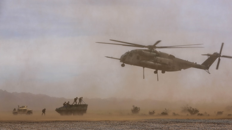 Marines with 1st Transportation Support Battalion and Combat Logistics Battalion 26 provide Helicopter Support Teams for external lift training in support of Marine Aviation Weapons and Tactics Squadron 1 during the semiannual Weapons and Tactics Instructor Course 2-17, at Auxiliary Airfield II, Yuma, Arizona, April 7, 2017. Lasting seven weeks, WTI is a training evolution hosted by MAWTS-1 which provides standardized advanced and tactical training and certification of unit instructor qualifications to support Marine aviation training and readiness. 