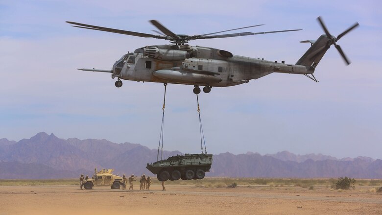 Marines with 1st Transportation Support Battalion and Combat Logistics Battalion 26 provide Helicopter Support Teams for external lift training in support of Marine Aviation Weapons and Tactics Squadron 1 during the semiannual Weapons and Tactics Instructor Course 2-17, at Auxiliary Airfield II, Yuma, Arizona, April 7, 2017. Lasting seven weeks, WTI is a training evolution hosted by MAWTS-1 which provides standardized advanced and tactical training and certification of unit instructor qualifications to support Marine aviation training and readiness. 