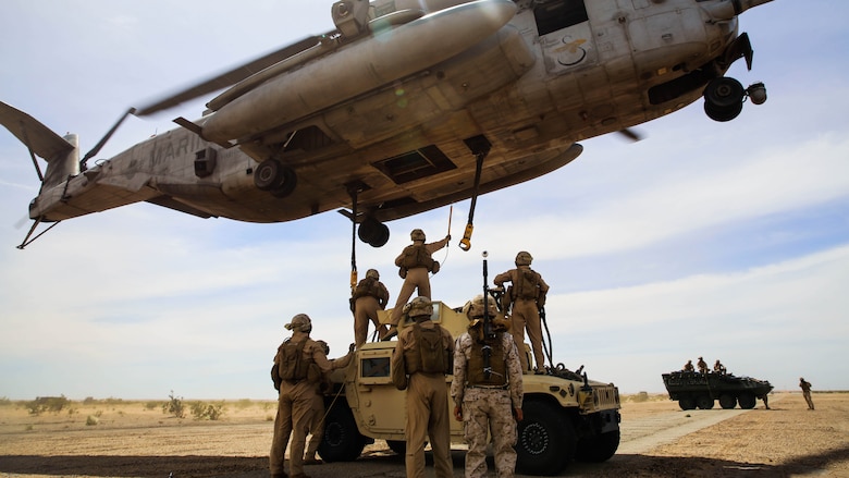 Marines with 1st Transportation Support Battalion and Combat Logistics Battalion 26 provide a Helicopter Support Team to attach a Humvee to a CH-53E Super Stallion for external lift training in support of Marine Aviation Weapons and Tactics Squadron 1 during the semiannual Weapons and Tactics Instructor Course 2-17, at Auxiliary Airfield II, Yuma, Arizona, April 7, 2017. Lasting seven weeks, WTI is a training evolution hosted by MAWTS-1 which provides standardized advanced and tactical training and certification of unit instructor qualifications to support Marine aviation training and readiness. 