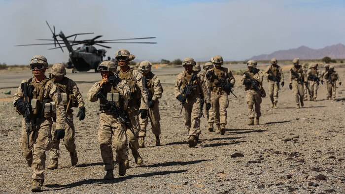 Marines with Echo Company 2nd Battalion 6th marines return from conducting fast rope training in support of Marine Aviation Weapons and Tactics Squadron 1 during the semiannual Weapons and Tactics Instructor Course 2-17, at Auxiliary Airfield II, Yuma, Arizona, April 7, 2017. Lasting seven weeks, WTI is a training evolution hosted by MAWTS-1 which provides standardized advanced and tactical training and certification of unit instructor qualifications to support Marine aviation training and readiness.