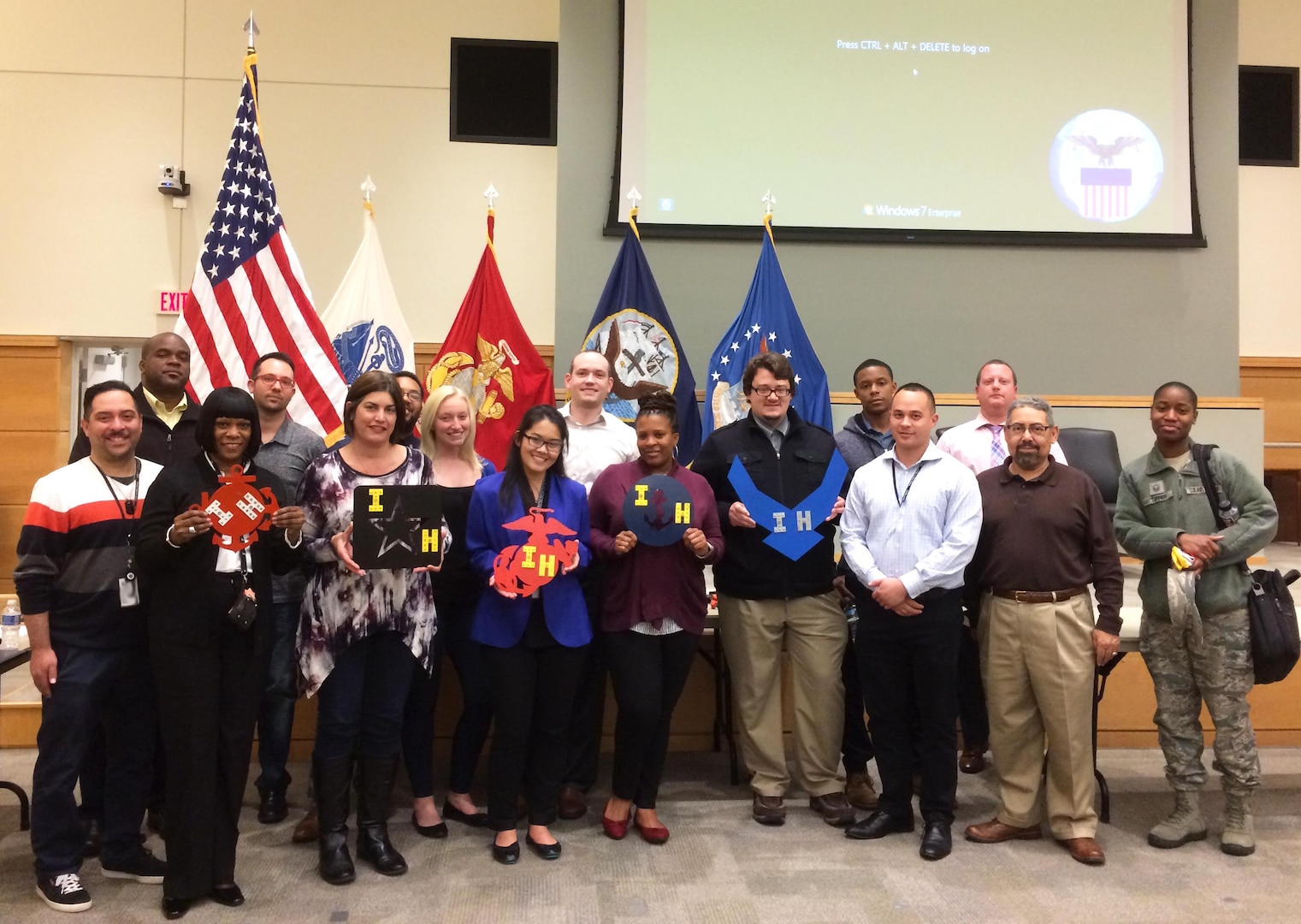 Employees from the DLA Troop Support Industrial Hardware supply chain participate in a Cross Function Day activity in the Bldg. 6 auditorium April 6. Personnel worked in small teams to construct military service insignia with hardware managed by the IH supply chain. The Cross Function Day event was designed to boost information-sharing across the supply chain’s diverse units and functions. 
