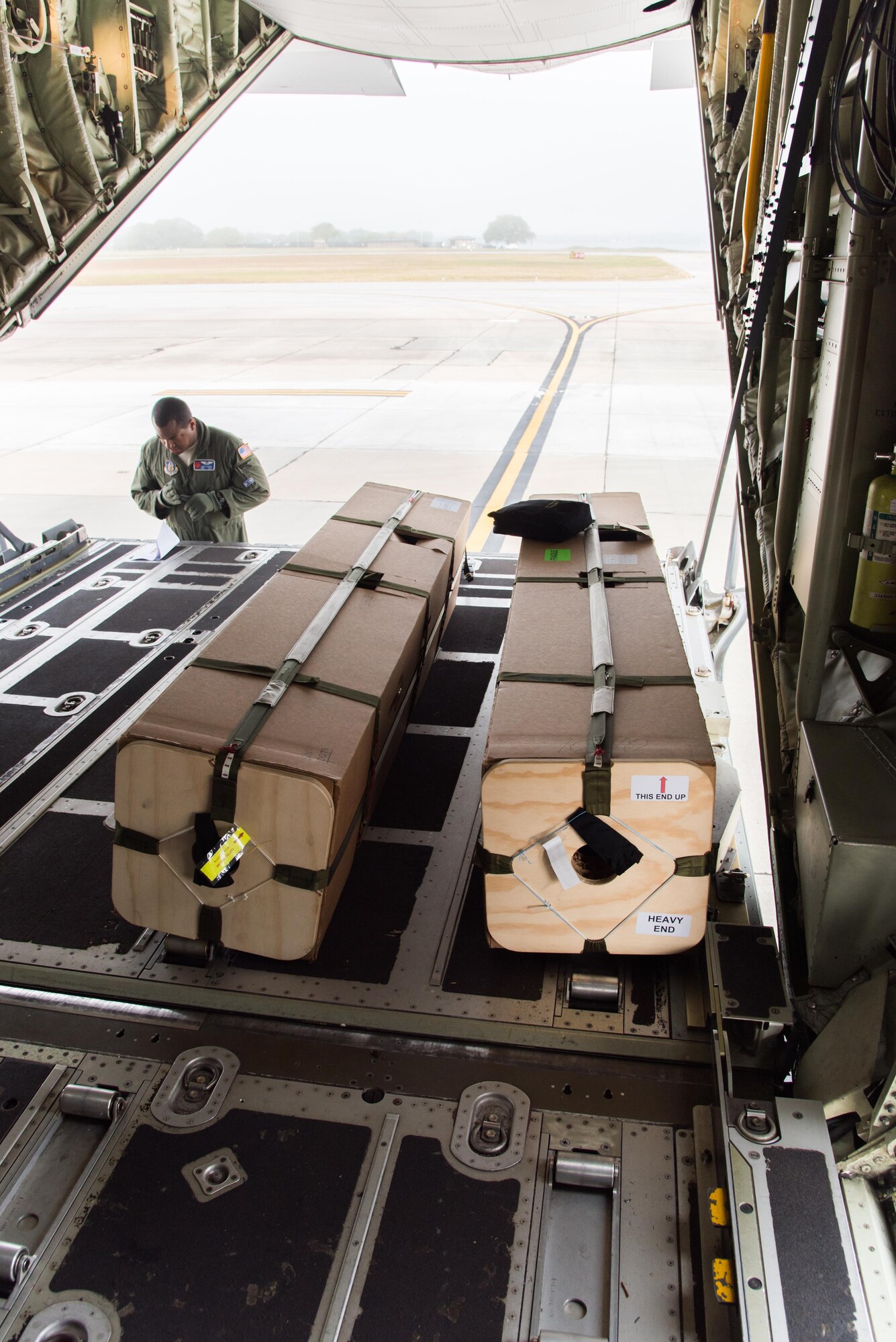 Staff Sgt. Larry Banks, 53rd Weather Reconnaissance Squadron loadmaster, reads instructions for U.S. Navy weather buoys Apirl 12 at Keesler Air Force Base, Mississippi. These buoys were dropped in preparation for the Naval Oceanography unmanned systems Gulf of Mexico Operational Demonstration scheduled to take place May 30 through June 1 in Gulfport. This joint training opportunity allows the 53rd WRS and Navy personnel to practice collecting and analyzing atmospheric and oceanic data.(U.S. Air Force photo/Staff Sgt. Heather Heiney)