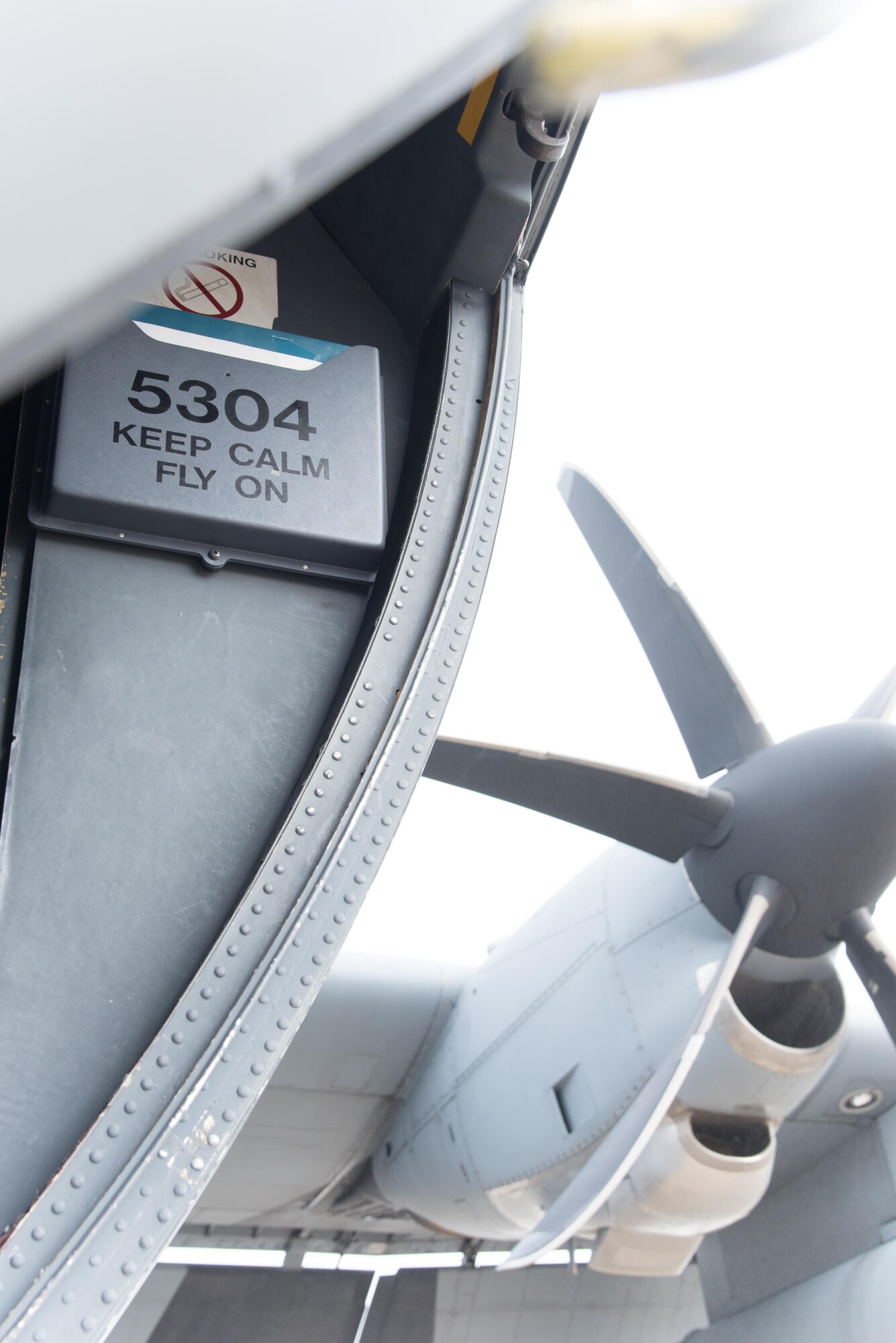 A WC-130J Super Hercules aircraft with the 53rd Weather Reconnaissance Squadron "Hurricane Hunters" with a sign that reads "Keep calm fly on" is surrounded by fog April 12 at Keesler Air Force Base, Mississippi. (U.S. Air Force photo/Staff Sgt. Heather Heiney)