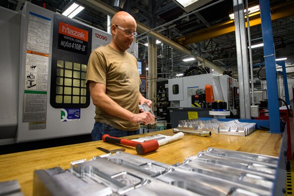 Machinist Tom Henrie, 532nd Commodities Maintenance Sqaudron, checks dimensions on an A-10 Thunderbolt II fitting, Hill Air Force Base, Utah, March 20, 2017. (U.S. Air Force photo/R. Nial Bradshaw)