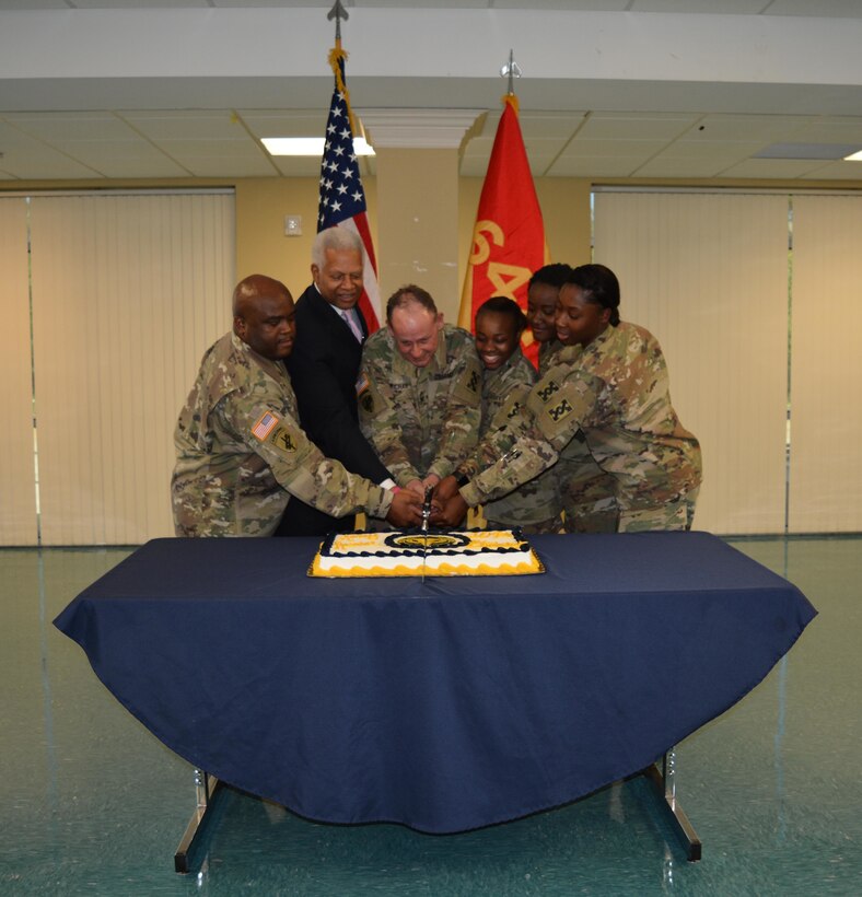 From L to R: Sgt. Maj., Derrick Jackson, 642d Regional Support Group Sgt. Maj., U.S. Rep. Hank Johnson, D-Ga., Col. Jeffrey L. Richar, commander of the 642d Regional Support Group along with three of the most junior enlisted Soldiers in the brigade, cut the 109th Army Reserve birthday cake in Decatur, Ga., Apr. 8, 2017.