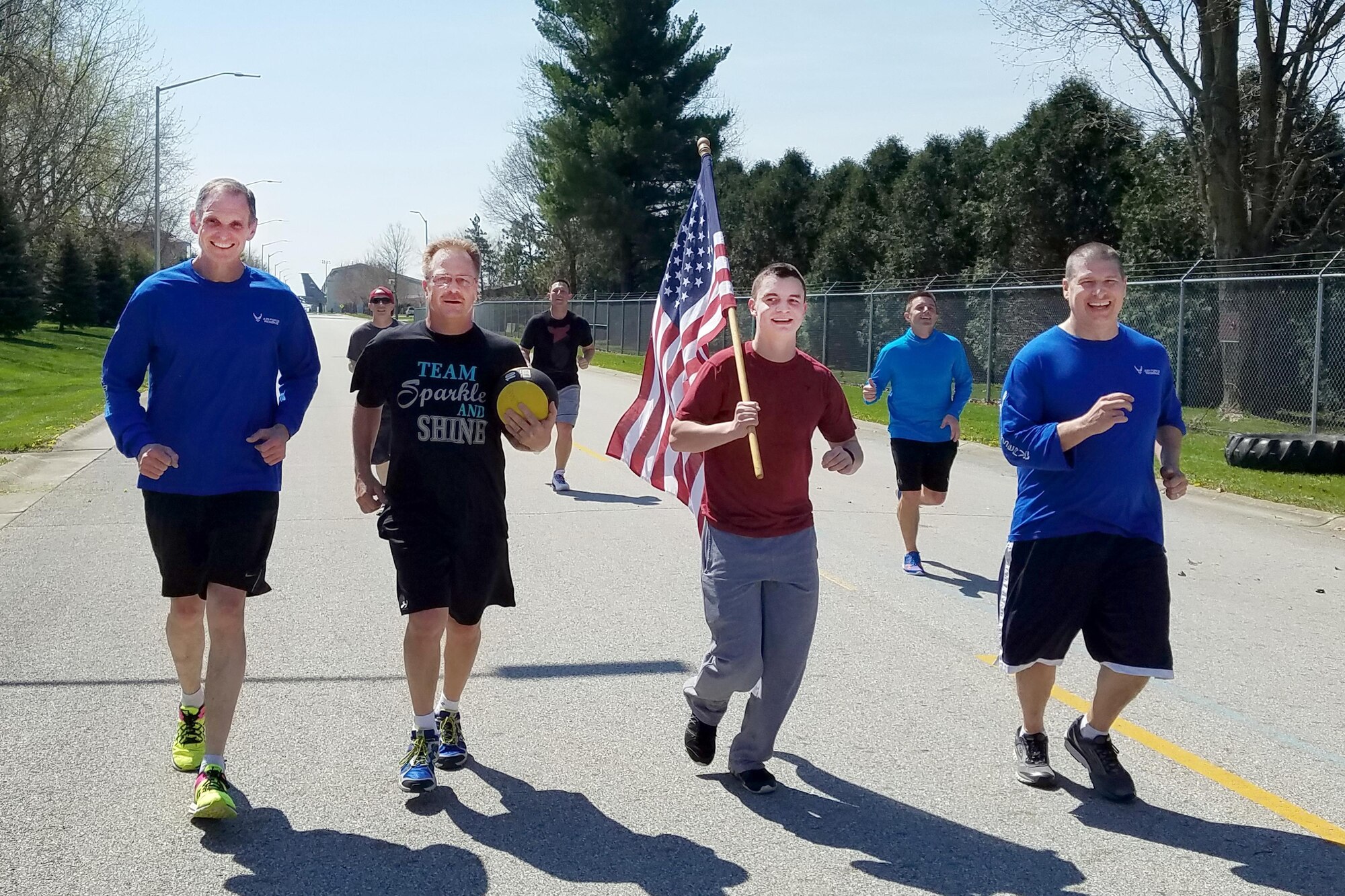 A team participating in Grissom's annual Easter Egg run approach the end of the race outside the fitness center at Grissom Air Reserve Base, Ind., April 12, 2017. Runners were placed in teams and were required to complete random challenges at various stations where they would receive the challenge from a plastic egg.