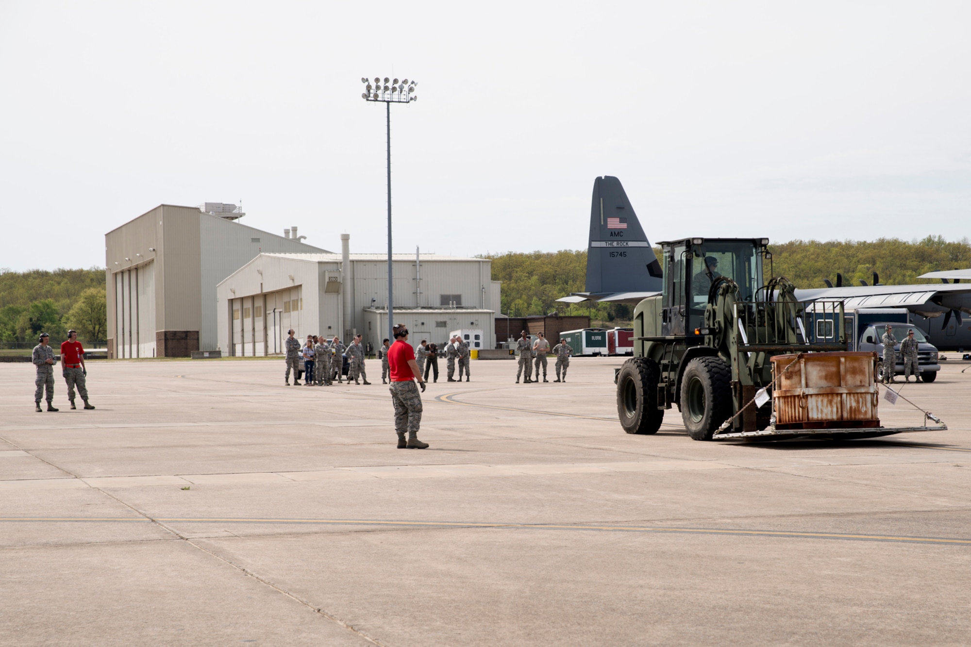 U.S. Air Force Reserve Airmen from the 913th Airlift Group gather on the ramp to support a team of Airmen assigned to 96th Aerial Port Squadron as they practice loading and unloading a C-130J Super Hercules during the Unit Training Assembly (UTA) weekend April 2, 2017, at Little Rock Air Force Base, Ark. The team will be competing in this year’s Port Dawg Challenge at Dobbins Air Reserve Base, Ga. (U.S. Air Force photo by Master Sgt. Jeff Walston/Released)