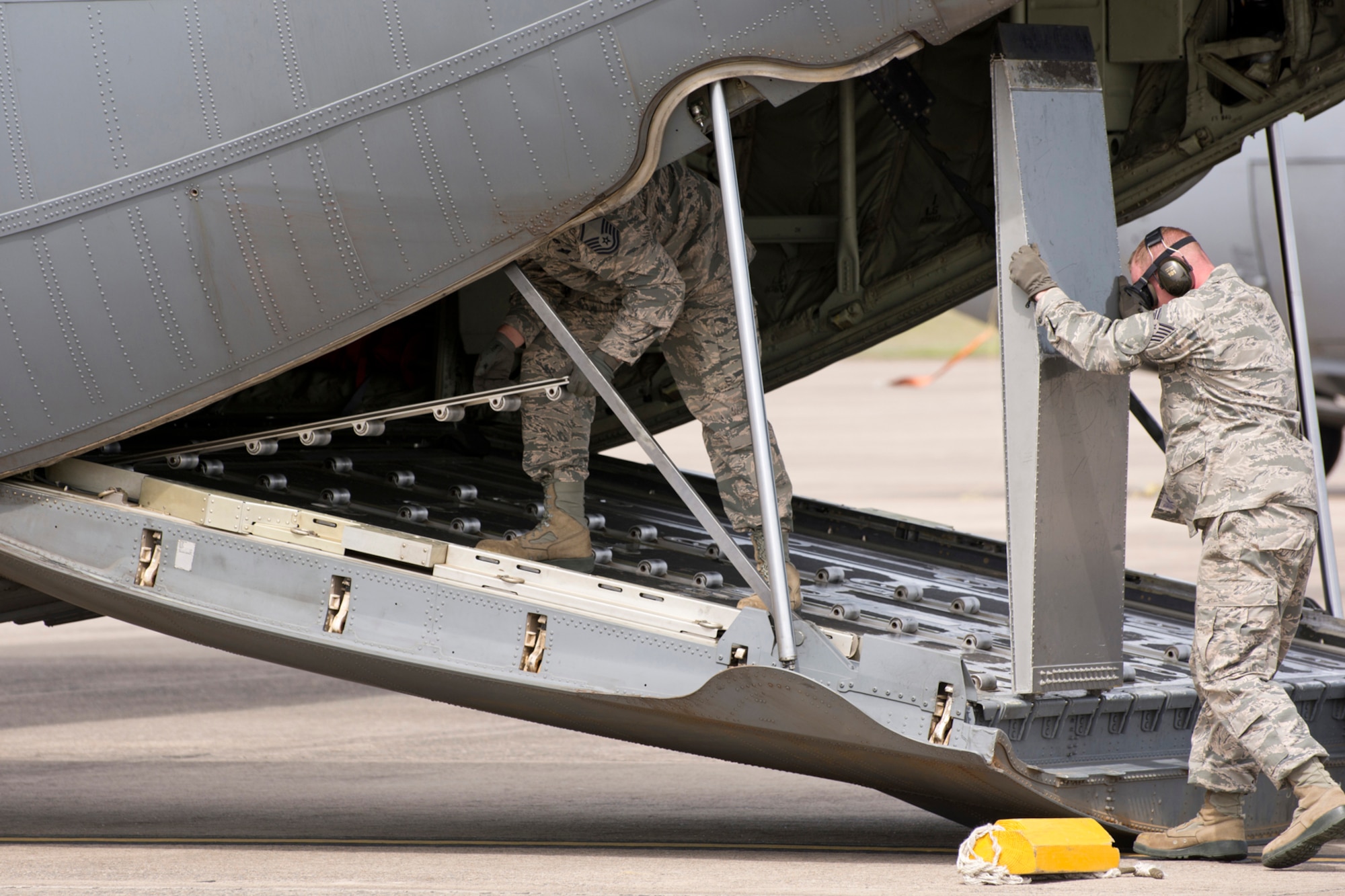 U.S. Air Force Reserve Master Sgt. Morgan Abner, air transportation craftsman, 96th Aerial Port Squadron, and Tech Sgt. Jason Gibson, air transportation journeyman, 96 APS, reconfigure a C-130J after loading a Humvee during in the course of an Engines Running On-Load/Odd-Load (ERO) training exercise during the Unit Training Assembly (UTA) weekend April 2, 2017, at Little Rock Air Force Base, Ark.  The two Airmen are part of a team preparing to compete in the 2017 Port Dawg Challenge for air mobility professionals, at Dobbins Air Reserve Base, Ga. (U.S. Air Force photo by Master Sgt. Jeff Walston/Released)