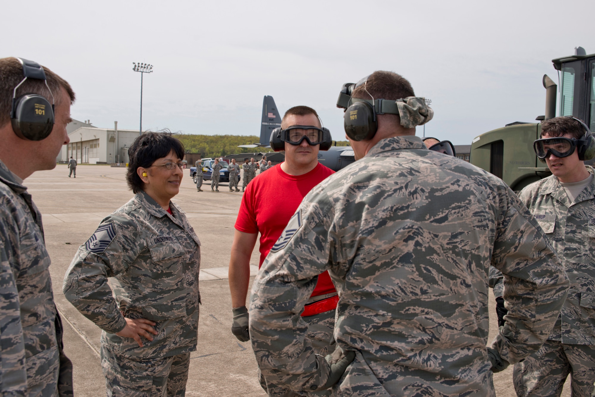 U.S. Air Force Reserve Chief Master Sgt. Cynthia Underwood, the 96th Aerial Port Squadron superintendent, receives a quick briefing after a training exercise April 2, 2017, at Little Rock Air Force Base, Ark. A 96 APS air transportation team is preparing to compete in the 2017 Port Dawg Challenge at Dobbins Air Reserve Base, Ga., and had just completed an Engines Running On-Load/Odd-Load of a C-130J Super Hercules as part of their groundwork for the event. The event was won by the 96 APS in 2012. (U.S. Air Force photo by Master Sgt. Jeff Walston/Released)