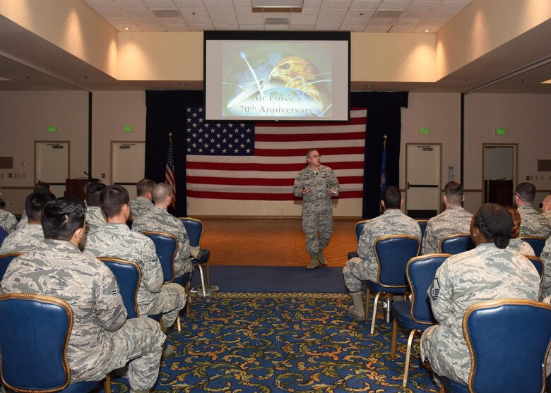 Col. J. Christopher Moss, 30th Space Wing commander, speaks to Airmen during an All-Call, April 11, 2017, Vandenberg Air Force Base, Calif. Accompanied by Chief Master Sgt. Robert Bedell, 30th SW command chief, the duo used the opportunity to communicate directly with Team V Airmen and praise them for their numerous accolades earned in 2016. (U.S. Air Force photo by Senior Airman Kyla Gifford/Released)