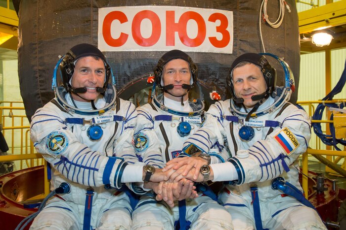 At the Integration Facility at the Baikonur Cosmodrome in Kazakhstan, Expedition 49 crewmembers Shane Kimbrough of NASA (left) and Sergey Ryzhikov (center) and Andrey Borisenko (right) of Roscosmos pose for pictures Sept. 9 in front of their Soyuz MS-02 spacecraft during a pre-launch training fit check. Kimbrough, Ryzhikov and Borisenko will launch Sept. 24, Kazakh time on the Soyuz MS-02 vehicle for a five-month mission on the International Space Station.

NASA/Victor Zelentsov