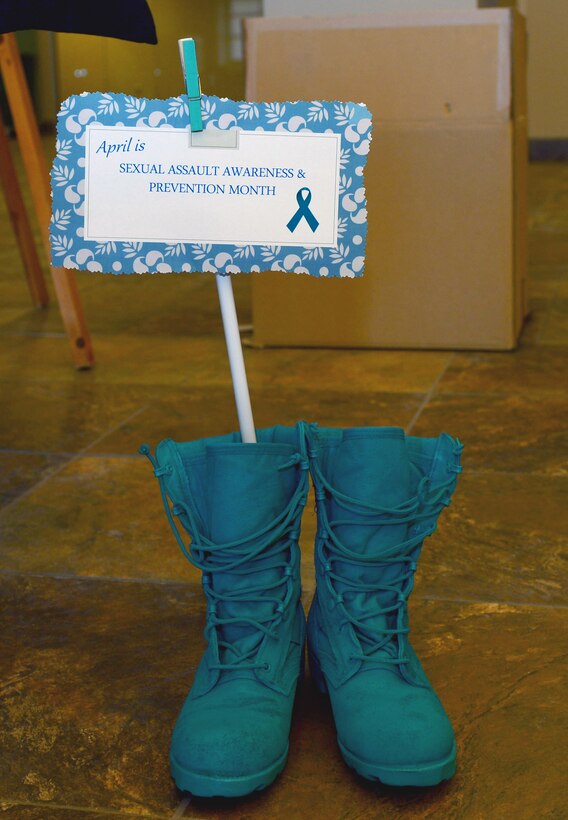 A pair of teal colored combat boots were placed in the Deployment Center as a part of a Sexual Assault Awareness and Prevention Month display at Ellsworth Air Force Base, S.D., April 11, 2017. The day-to-day mission of the Air Force Sexual Assault Prevention and Response Office is to educate, advocate and collaborate to respond to, and stop sexual assault and its harmful effects on the Air Force. (U.S. Air Force photo by Airman 1st Class Donald C. Knechtel)