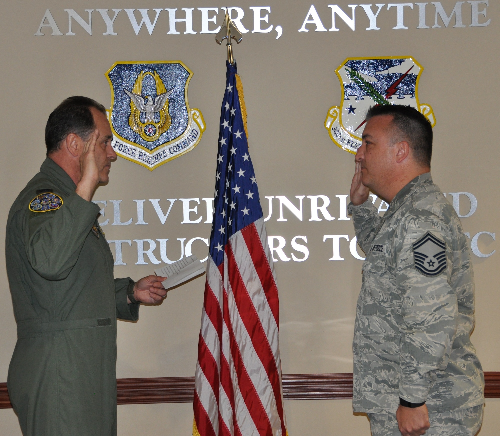 Senior Master Sgt. Jon Rousseaux receives his reenlistment oath from Col. Michael Vanzo, 340 FTG Director of Operations, Feb. 3, 2017. (Photo by Janis El Shabazz, 340 FTG Public Affairs).