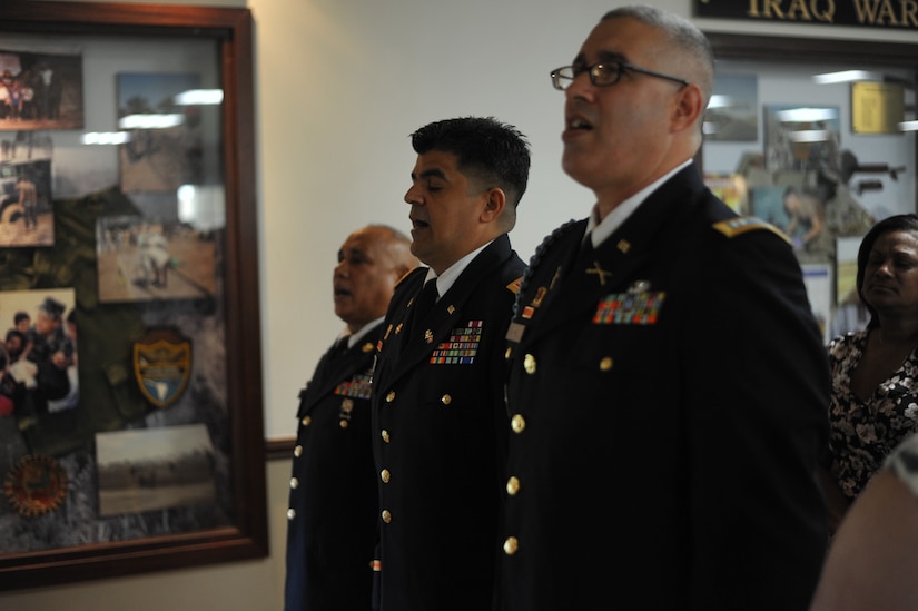 1st Sgt. Hector Rodriguez, Cpt. Adelso Antonio and Cpt. Jose R. Medina sing the Army Song during the Retirement Ceremony held at Ramon Hall on Fort Buchanan, April 8.
