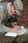 Competitor Sgt. Curtis Presley, with the 380th Army Band, 99th Regional Support Command, plots his points for land navigation at Fort Devens, Massachusetts, April 5, 2017, as part of the 2017 Joint 80th Training Command and 99th RSC Best Warrior Competition.