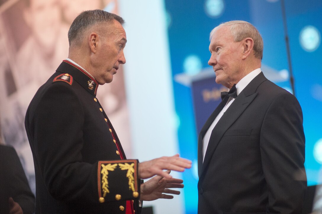 Marine Corps Gen. Joe Dunford, the chairman of the Joint Chiefs of Staff, speaks with his immediate predecessor as chairman, retired Army Gen. Martin E. Dempsey, who is now the president of USA Basketball, during the Tragedy Assistance Program for Survivors Honor Guard Gala at the National Building Museum April 12, 2017. DoD photo by Navy Petty Officer 2nd Class Dominique Pineiro