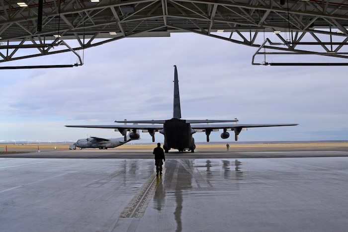 A C-130 Hercules aircraft is towed into the newly-constructed Building 80 at the 120th Airlift Wing in Great Falls, Mont. April 6, 2017. Building 80 will serve as the corrosion control and fuel cell maintenance facility for the Montana Air National Guard airlift wing. (U.S. Air National Guard photo/Senior Master Sgt. Eric Peterson)