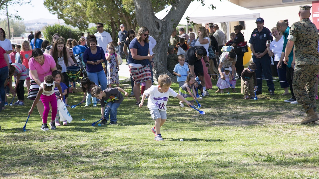 Children race against one another in the Easter Egg Roll held on the lawn of McTureous Hall during the annual event held aboard Marine Corps Logistics Base Barstow, Calif., April 12.