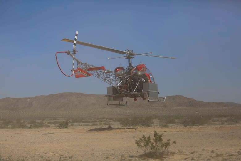 A helicopter lands to pick up desert tortoises and deliver them to a recipient site during the Desert Tortoise translocation, April 10, 2017, which was facilitated by the Marine Corps Air Ground Combat Center, Twentynine Palms, Calif. The translocation, in accordance with the U.S. Fish and Wildlife Service-signed Biological Opinion, serves as a negotiated mitigation to support a congressionally mandated land expansion which, will afford the Combat Center the ability to conduct Large Scale Exercise training of a Marine Expeditionary Brigade-level force. (U.S. Marine Corps photo by Cpl. Medina Ayala-Lo)
