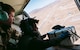 An Afghan Air Force member training with Train, Advise, Assist Command-Air, as part of Resolute Support Mission, works in tandem with an advisor to practice air drops near Kabul, Afghanistan, March 19, 2017. The TAAC-Air advisors foster working relationships and fortify confidence in the mission. (U.S. Air Force photo by Senior Airman Jordan Castelan)