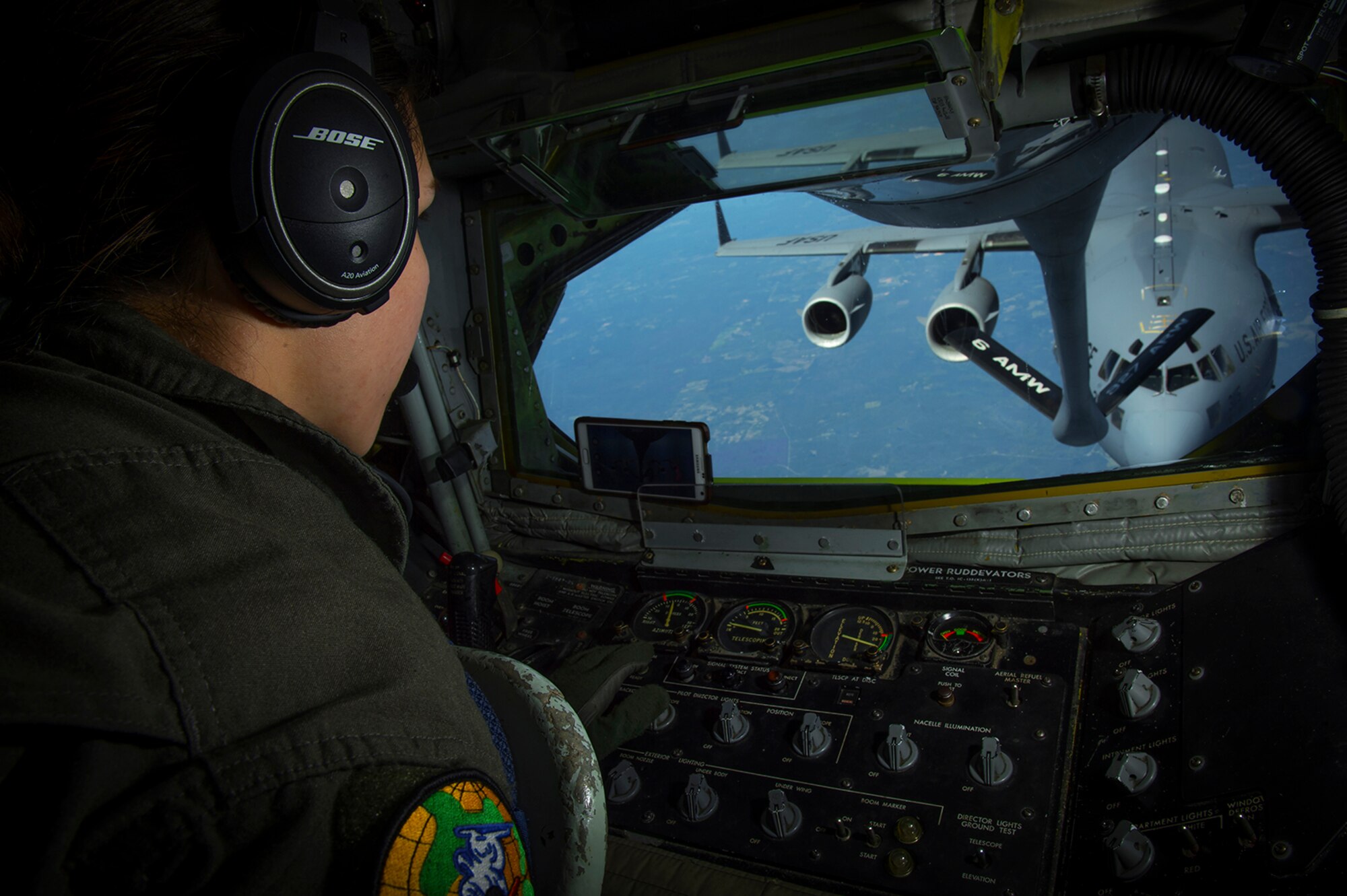 Senior Airman Jacqueline D’urso, a boom operator with the 91st Air Refueling Squadron, prepares to make contact with a C-17 Globemaster III aircraft during a refuel mission over the Southeast region of the U.S. April 4, 2017. In the first quarter of 2017, the 91st ARS flew 170 sorties in support of Operation Inherent Resolve, which included initial strikes during the Mosul offensive. (U.S. Air Force photo/Staff Sgt. Ned T. Johnston)