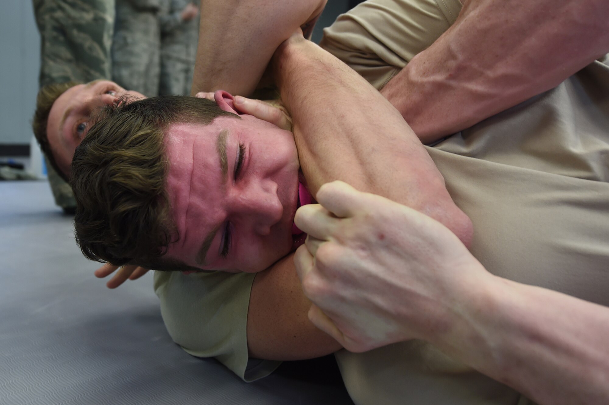 Senior Airman Matthew Timmons, a 673rd Security Forces Squadron member, attempts to break a hold during combatives training on Joint Base Elmendorf-Richardson, Alaska, April 4, 2017. Maintaining proficiency in hand-to-hand combat allows defenders to take control of situations where drawing a weapon might not be an option. (U.S. Air Force photo/Staff Sgt. Westin Warburton)