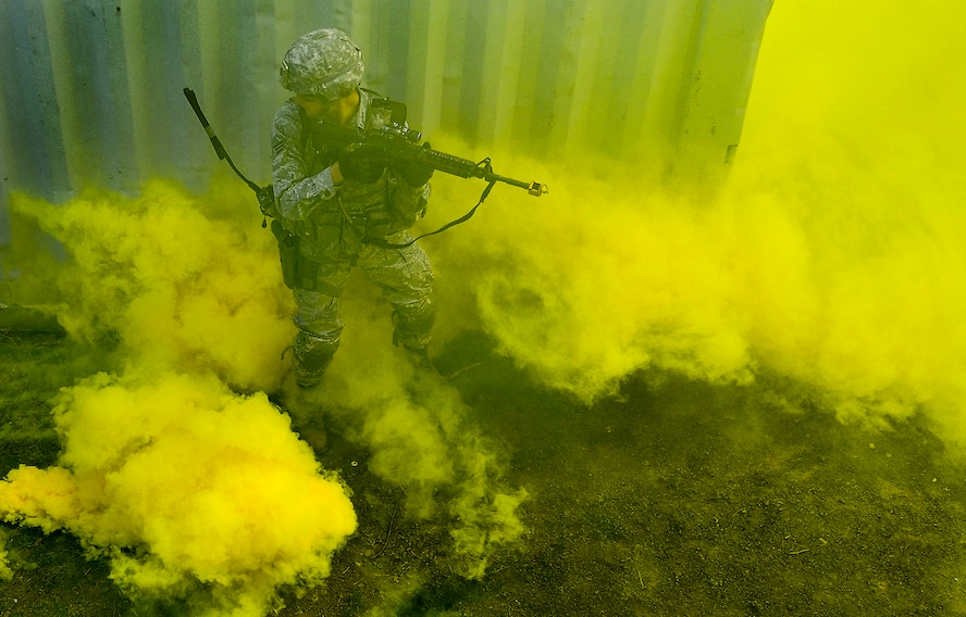 A student of the 435th Security Forces Squadron’s Ground Combat Readiness Training Center’s Security Operations Course is surrounded by smoke during the urban operations portion of the course on U.S. Army Garrison Baumholder, Germany, April 4, 2017. The students also performed mounted and dismounted operations. (U.S. Air Force photo/Senior Airman Tryphena Mayhugh)