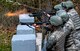Defenders from the 130th Security Forces Squadron at McLaughlin Air National Guard Base, W.Va. practice firing non-lethal rounds, which consist of rubber bullets, during riot control training April 5, 2017, at Camp Virgil Tate, W.Va. Security forces personnel participated in training that exposed them to numerous scenarios they may encounter during their duties as military police. (U.S. Air National Guard Photo/Tech. Sgt. De-Juan Haley)