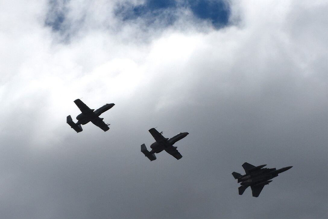 Two A-10C Thunderbolt IIs from Moody Air Force Base, Ga., and an F-15E Strike Eagle from Seymour Johnson AFB, N.C., fly in formation during exercise Razor Talon, April 7, 2017, over the skies of Seymour Johnson AFB. The monthly joint exercise provides an opportunity for military aircraft to work together to sharpen tactics, techniques and procedures in preparation for real world contingency operations. (U.S. Air Force photo/Airman 1st Class Victoria Boyton)