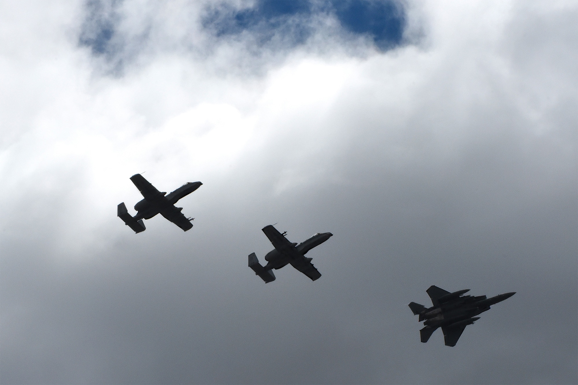 Two A-10C Thunderbolt IIs from Moody Air Force Base, Ga., and an F-15E Strike Eagle from Seymour Johnson AFB, N.C., fly in formation during exercise Razor Talon, April 7, 2017, over the skies of Seymour Johnson AFB. The monthly joint exercise provides an opportunity for military aircraft to work together to sharpen tactics, techniques and procedures in preparation for real world contingency operations. (U.S. Air Force photo/Airman 1st Class Victoria Boyton)