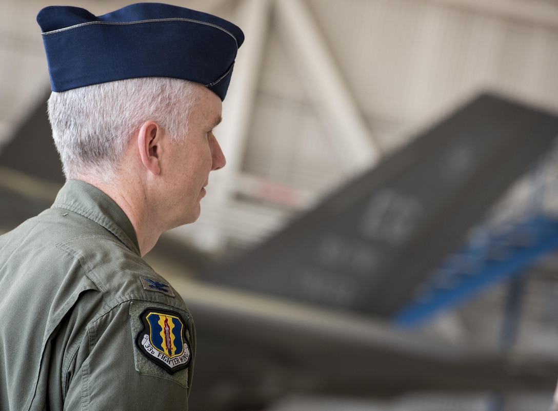 A 33rd Fighter Wing colonel stands at parade rest prior to the wing’s change of command ceremony at Eglin Air Force Base, Fla., April 13.  Col. Lance Pilch relinquished command of the training wing to Col. Paul Moga.  (U.S. Air Force photo/Samuel King Jr.)