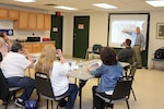 Restoration Advisory Board members, Defense Logistics Agency Installation Support at Richmond, Virginia leadership, and concerned citizens came together April 10, 2017, at the Bensley Community Center in Chesterfield County for the quarterly Restoration Advisory Board meeting. Britt McMillan, a DLA environmental contractor with Arcadis, gives update on Operable Units 7 and 8. 