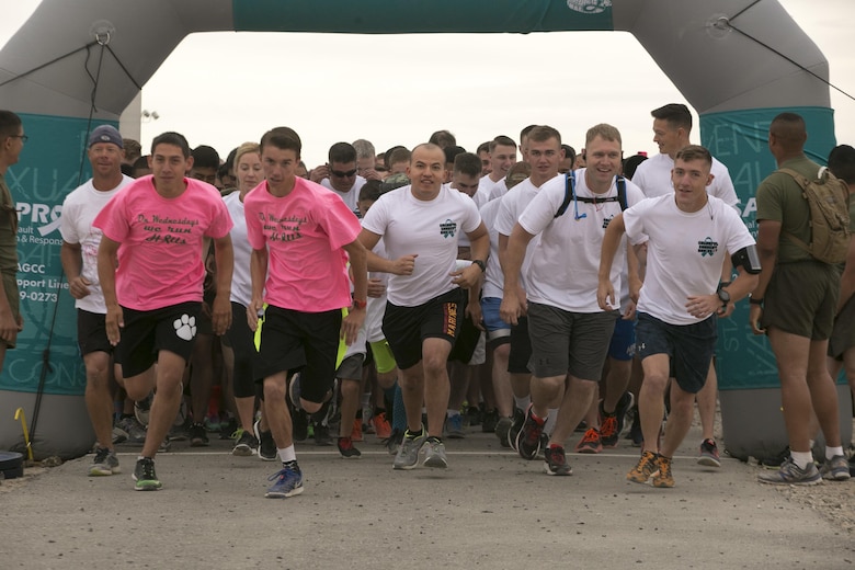 Runners begin the Sexual Assault Prevention and Response annual Colorful Consent 5k Run held aboard Marine Corps Air Ground Combat Center, Twentynine Palms, Calif., April 7, 2017. (U.S. Marine Corps Photo by Cpl. Julio McGraw)