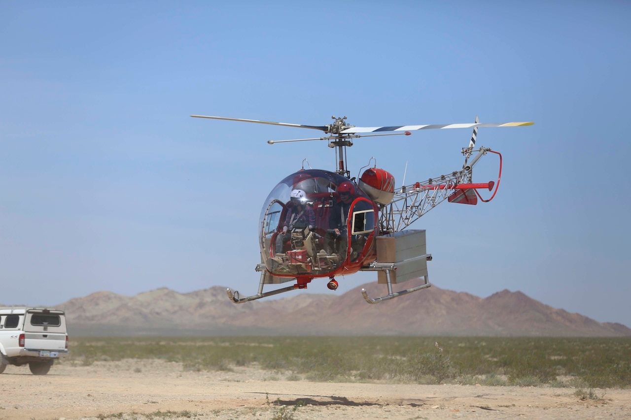 A helicopter transfers desert tortoises to a recipient site via helicopter during the Desert Tortoise translocation, April 10, 2017, which was facilitated by the Marine Corps Air Ground Combat Center, Twentynine Palms, Calif. The translocation, in accordance with the U.S. Fish and Wildlife Service-signed Biological Opinion, serves as a negotiated mitigation to support a congressionally mandated land expansion which, will afford the Combat Center the ability to conduct Large Scale Exercise training of a Marine Expeditionary Brigade-level force. (U.S. Marine Corps photo by Cpl. Medina Ayala-Lo)