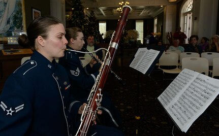 Airman 1st Class Laura McIntyer, Band of the West bassoonist, preforms for Gulf Coast residents and travelers at the Biloxi Visitor's Center Feb. 26, 2017 Biloxi, Miss. Members of the Spectrum Winds Quintet, an ensemble of the Band of the West, played a medley of concert and ceremonial marching music for the attendees. (U.S. Air Force photo by Andre' Askew)