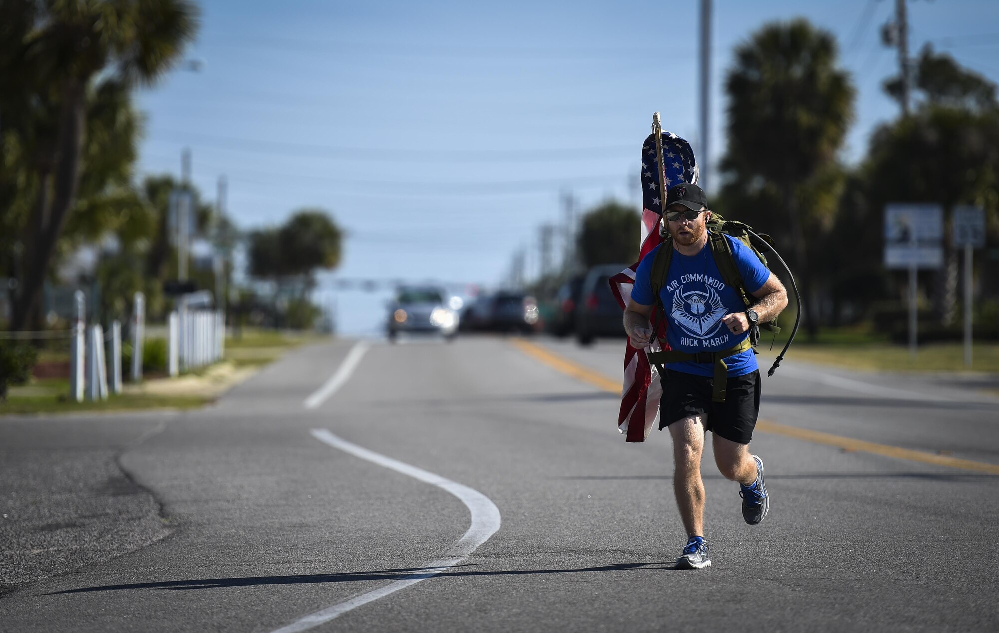 Tech. Sgt. Doug Iredale, a special missions aviator with the 4th Special Operations Squadron, marches in the 6th Annual Air Commando Ruck March at Panama City Beach, Fla., April 13, 2017. The Air Commando Ruckers marched 450 miles from MacDill Air Force Base, to Hurlburt Field. (U.S. Air Force photo by Airman 1st Class Joseph Pick)