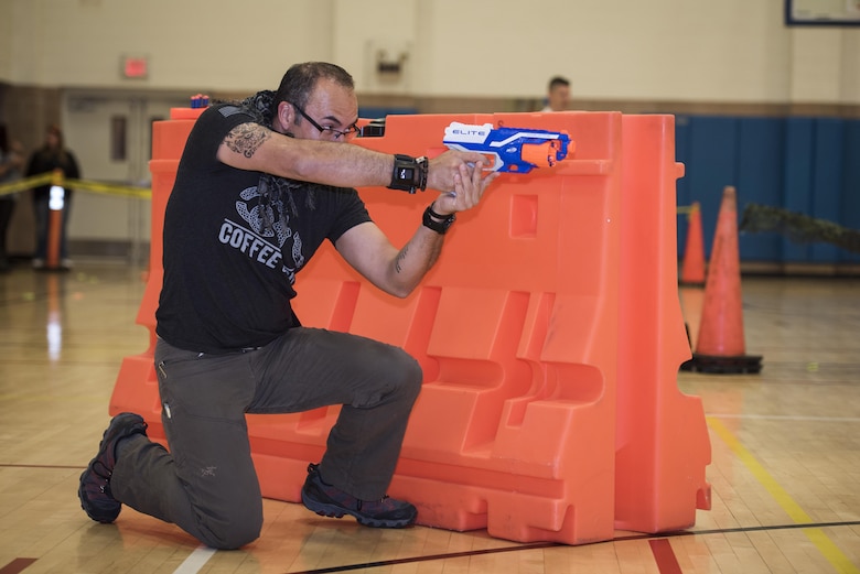 Cesar Diaz, Red River Hospital military hereos unit case manager and therapist, participates in the Sheppard Air Force Base, Texas, Family Advocacy Nerf night, April 13, 2017. The Nerf night was held to encourage families to unplug from electronic devices and spend time bonding as families. (U.S. Air Force photo by Staff Sgt. Kyle E. Gese)