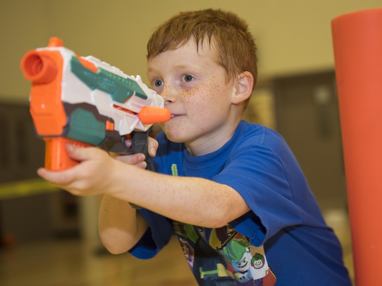 Keegan Macveigh, son of Master Sgt. Erich Marquardt and Airman 1st Class Katrina Marquardt, participates in the heated Nerf night at Sheppard Air Force Base, Texas, April 13, 2017. The Nerf night was held to encourage families to unplug from electronic devices and spend time bonding as families. (U.S. Air Force photo by Staff Sgt. Kyle E. Gese)