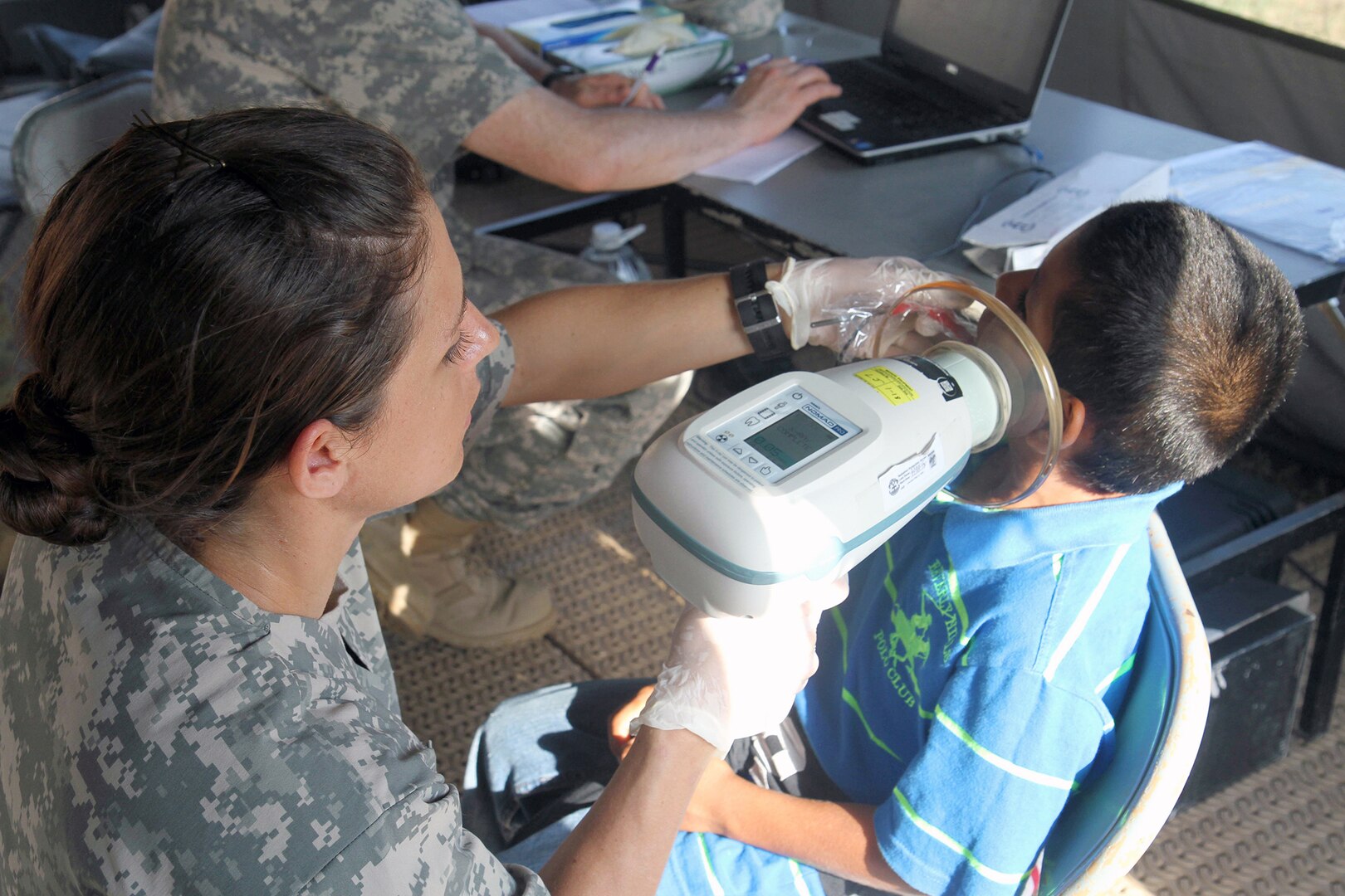 Sgt. Samantha Miller, a dental technician assigned to the Utah National Guard Medical Command, takes dental x-rays of a young patient April 9, 2017, during a free medical event held in Ladyville, Belize as a part of Beyond the Horizon 2017.  BTH 2017 is an on-going partnership exercise between the Government of Belize and U.S. Southern Command that will provide three free medical service events and five construction projects throughout the country of Belize from March 25 until June 17. (U.S. Army Photo by Staff Sgt. Fredrick Varney, 131st Mobile Public Affairs Detachment)