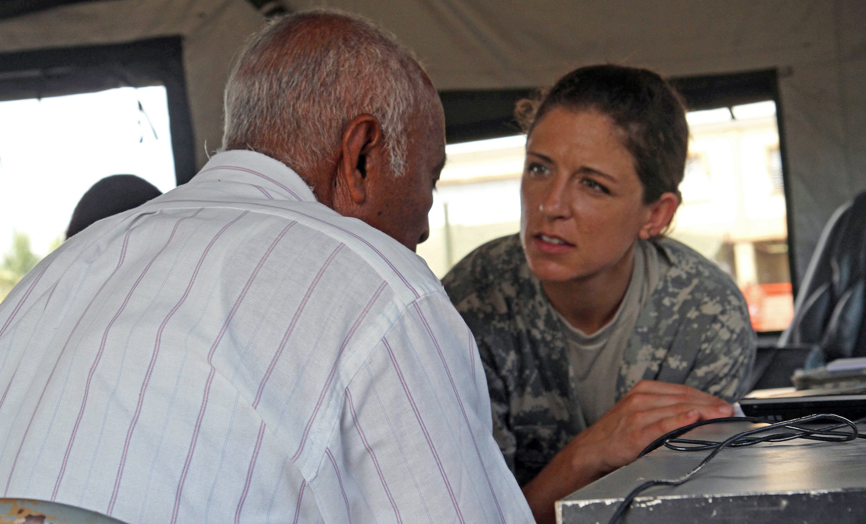 Sgt. Samantha Miller, a dental technician assigned to the Utah National Guard Medical Command, speaks with a local Belizean man about dental treatment April 9, 2017, during a free medical event held in Ladyville, Belize as a part of Beyond the Horizon 2017.  BTH 2017 is an on-going partnership exercise between the Government of Belize and U.S. Southern Command that will provide three free medical service events and five construction projects throughout the country of Belize from March 25 until June 17. (U.S. Army Photo by Staff Sgt. Fredrick Varney, 131st Mobile Public Affairs Detachment)