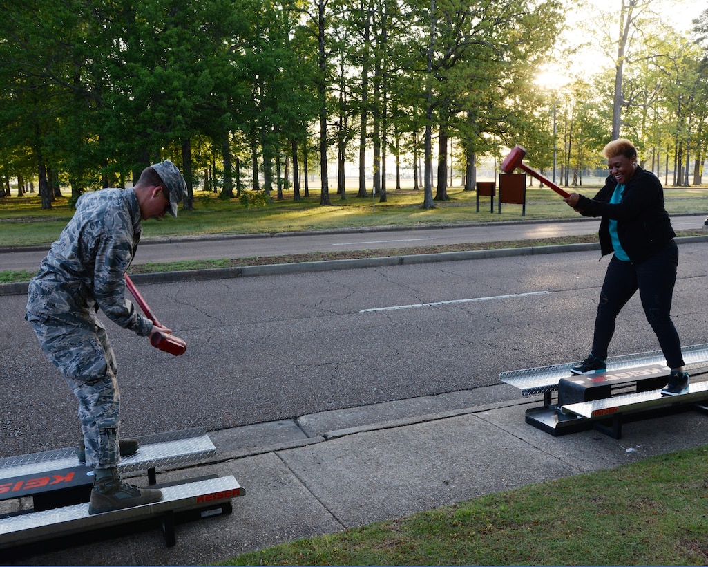 Airman 1st Class Michael Findlay, 14th Civil Engineer Squadron Firefighter, and Carla Neal-Bush, Sexual Assault Prevention and Response Victim Advocate, compete in a firefighter-themed obstacle course during the SAPR 5k Run For Recovery April 13, 2017, Columbus Air Force Base, Mississippi. The SAPR Office held a 5k run with five different obstacles that represent the steps to recovery after a sexual assault. (U.S. Air Force photo by Airman 1st Class Beaux Hebert)
