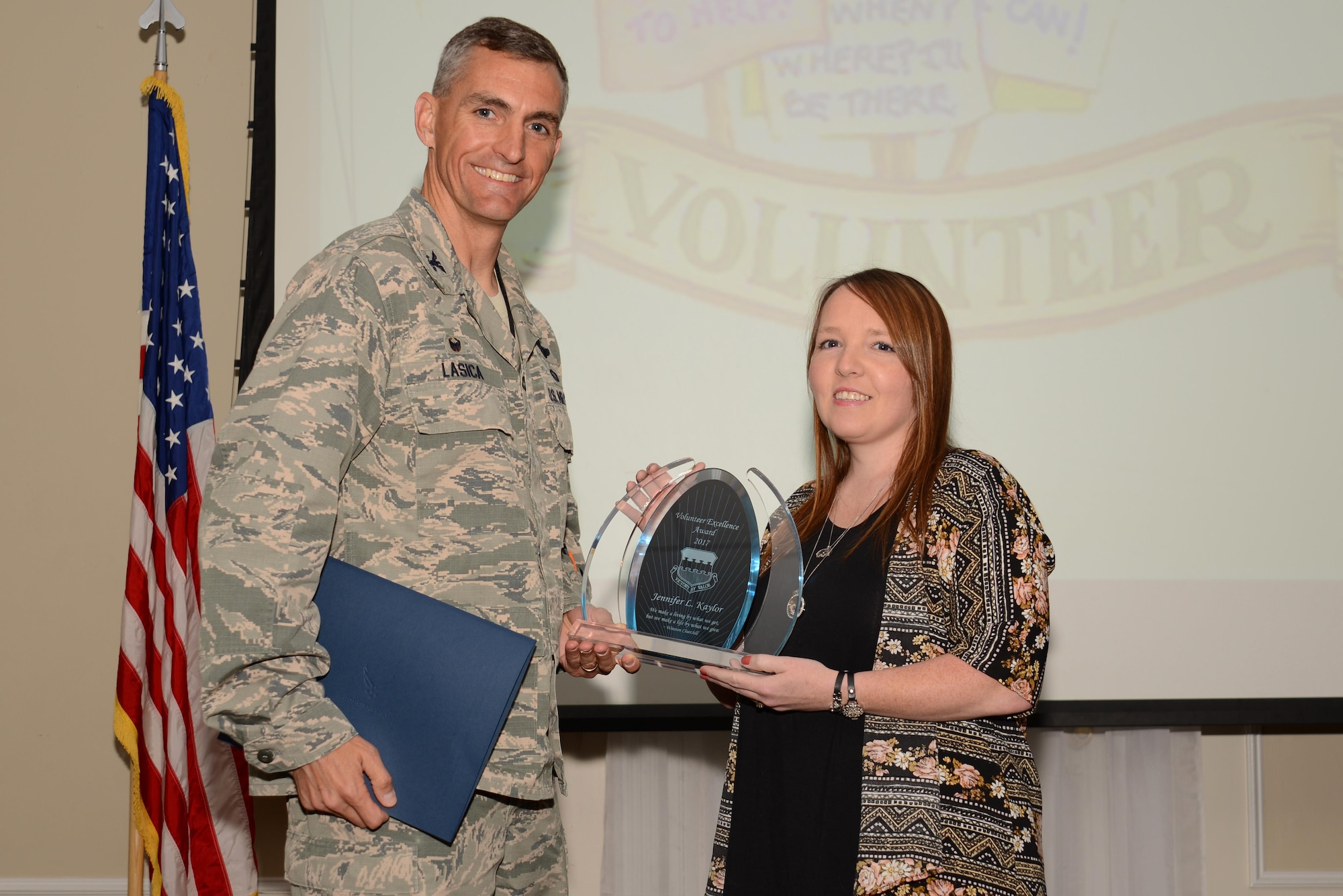 U.S. Air Force Col. Daniel Lasica, 20th Fighter Wing commander, presents Jennifer Kaylor, 20th Aircraft Maintenance Squadron Key Spouse and Shaw’s Attic coordinator, the 2017 Volunteer Excellence Award at Shaw Air Force Base, S.C., April 13, 2017. Kaylor was recognized for her continuous contributions to the community, which benefitted Air Force and Army families. (U.S. Air Force photo by Airman 1st Class Kathryn R.C. Reaves)