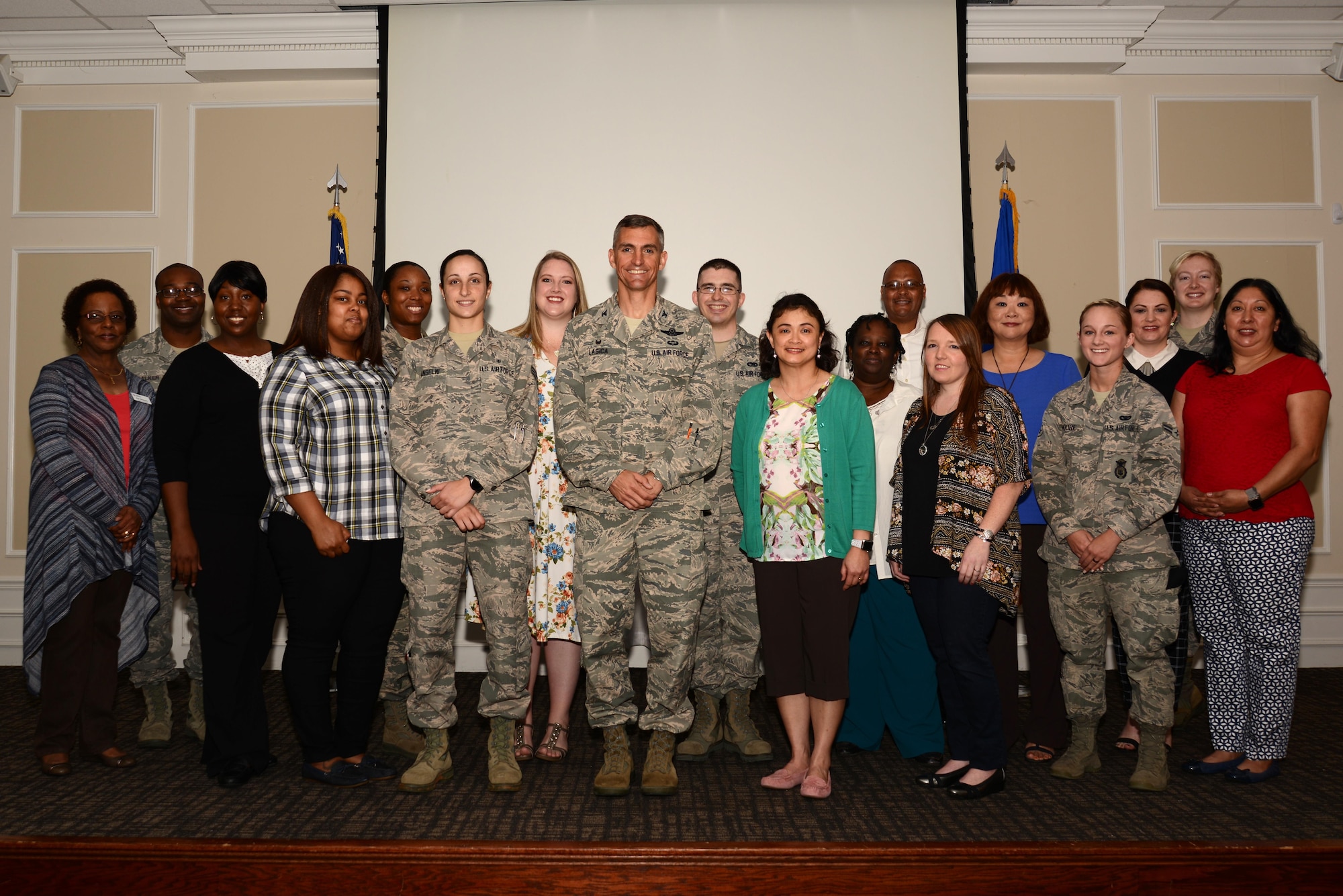 U.S. Air Force Col. Daniel Lasica, 20th Fighter Wing commander, center, stands with Team Shaw volunteers during a volunteer appreciation breakfast at Shaw Air Force Base, S.C., April 13, 2017. Volunteers contributed their time to organizations such as Shaw’s Attic, Key Spouse Program, and youth sports and academic programs. (U.S. Air Force photo by Airman 1st Class Kathryn R.C. Reaves)