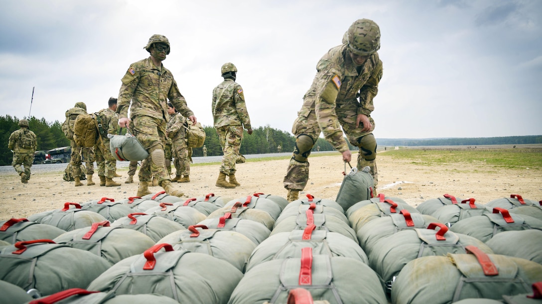 Paratroopers drop off their gear at a rally point during training at the 7th Army Joint Multinational Training Command's Grafenwoehr Training Area in Germany, April 13, 2017. The paratroopers are assigned to the 4th Battalion, 319th Airborne Field Artillery Regiment, 173rd Airborne Brigade. Army photo by Spc. Javon Spence