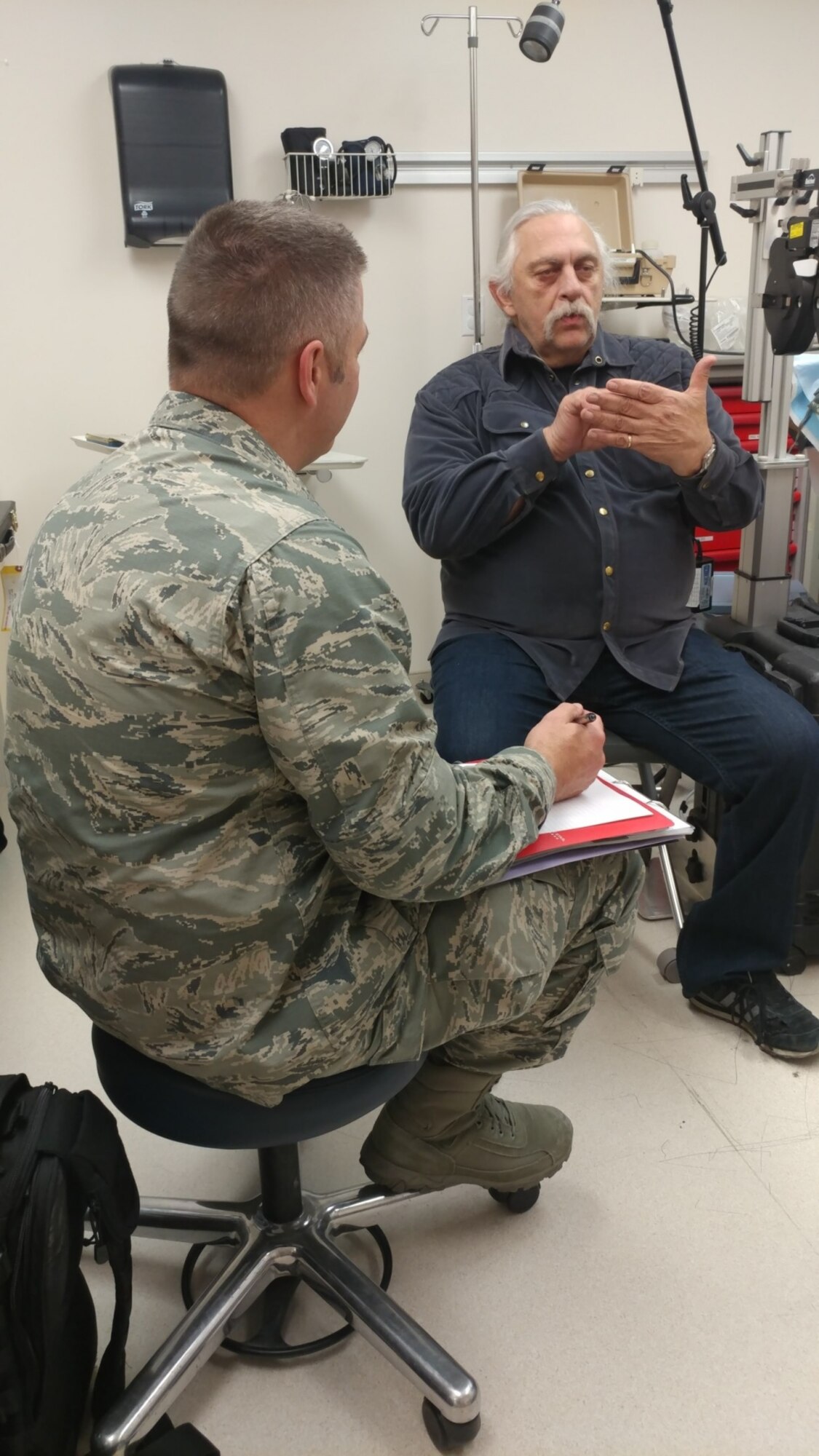 Air Force Major Brett Ringger, 136th Medical Group, Texas Air National Guard, provide eye exams to patients in a portable optometry clinic during ARCTIC CARE 2017, Port Lions, Alaska, on March 29, 2017. ARCTIC CARE 2017 is part of the Innovative Readiness Training program, which is an Office of Secretary of Defense sponsored civil-military collaboration intended to build on mutually beneficial partnerships between U.S. communities and the Department of Defense. ARCTIC CARE 2017 provides training opportunities for U.S. military (Active, Guard, Reserve) and Canadian Health service members to prepare for worldwide deployment while supporting the needs of underserved communities on Kodiak Island, Alaska. (U.S. Air Force photo by Tech. Sgt. Wendy Day) 