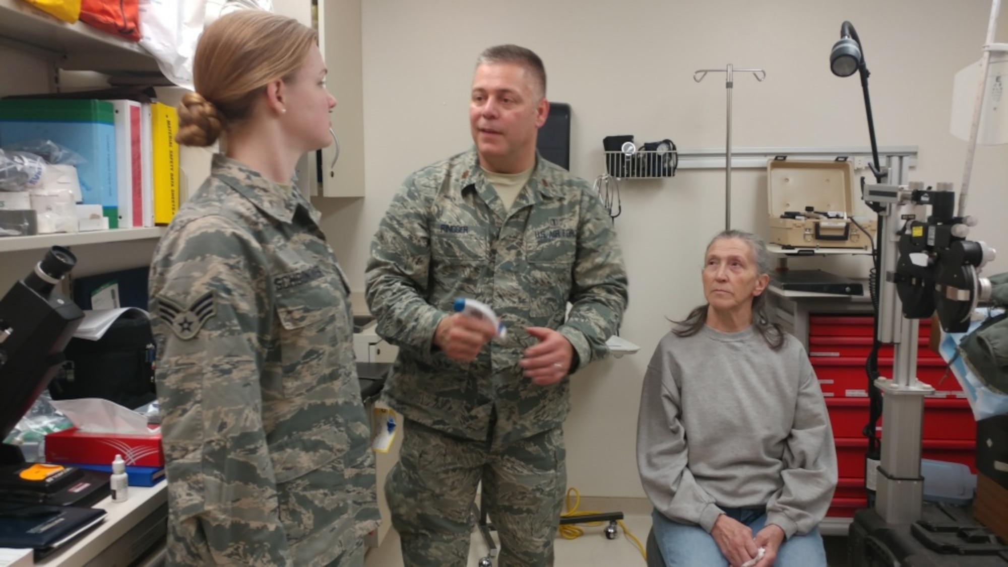 Senior Airman Lauren Schoonover, 147th Medical Group, Ellington Field Joint Reserve Base, Texas, and Major Brett Ringger, 136th Medical Group, Texas Air National Guard, treat local resident in pop-up optometry clinic during ARCTIC CARE 2017, Port Lions, Alaska, March 28, 2017. ARCTIC CARE 2017 is part of the Innovative Readiness Training program, which is an Office of Secretary of Defense sponsored civil-military collaboration intended to build on mutually beneficial partnerships between U.S. communities and the Department of Defense. ARCTIC CARE 2017 provides training opportunities for U.S. military (Active, Guard, Reserve) and Canadian Health service members to prepare for worldwide deployment while supporting the needs of underserved communities on Kodiak Island, Alaska. (U.S. Force Photo by Tech. Sgt. Wendy Day)