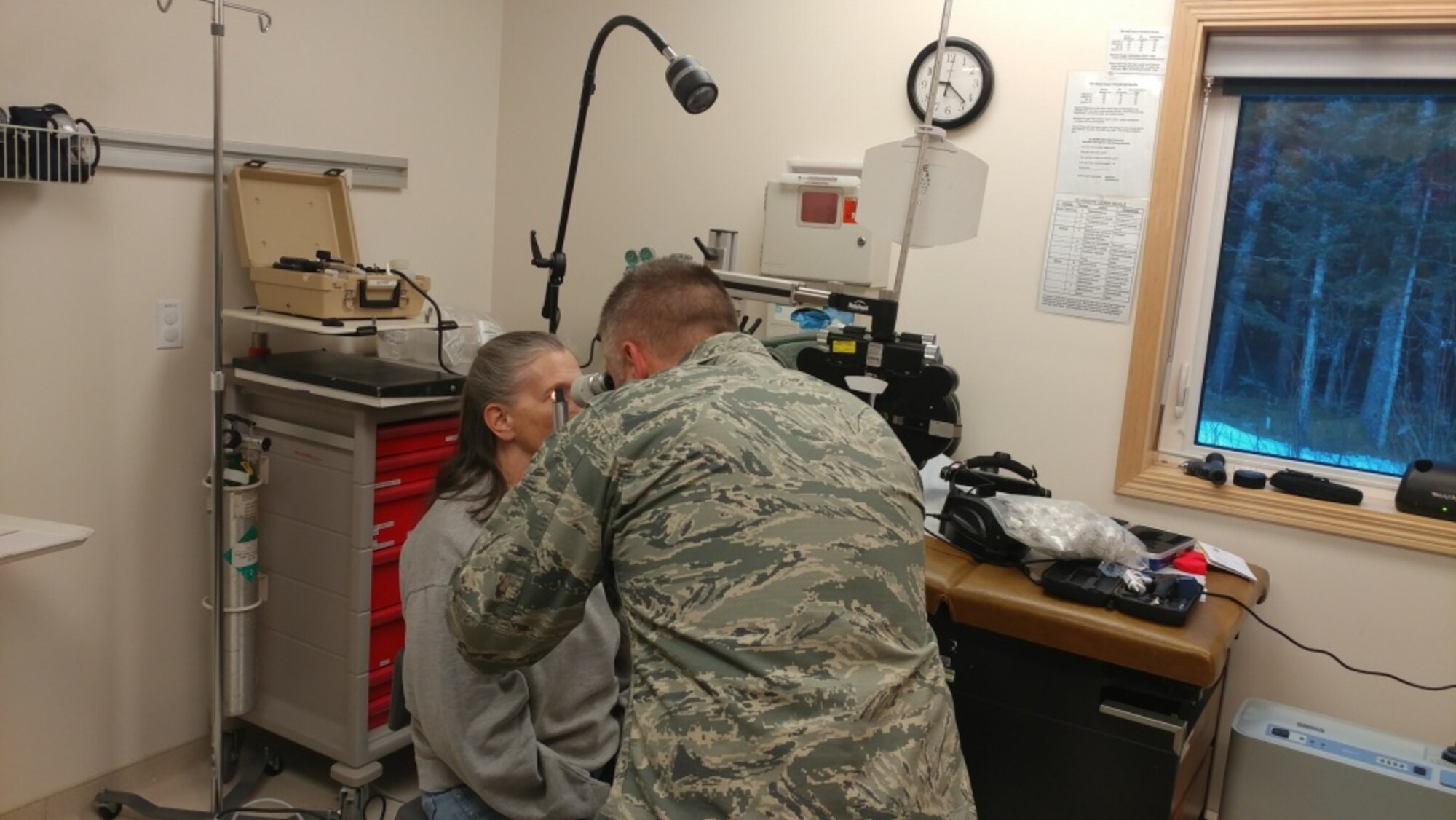 Air Force Major Brett Ringger, 136th Medical Group, Texas Air National Guard, provide eye exams in a portable optometry clinic during ARCTIC CARE 2017, Port Lions, Alaska, March 28, 2017. ARCTIC CARE 2017 is part of the Innovative Readiness Training program, which is an Office of Secretary of Defense sponsored civil-military collaboration intended to build on mutually beneficial partnerships between U.S. communities and the Department of Defense. ARCTIC CARE 2017 provides training opportunities for U.S. military (Active, Guard, Reserve) and Canadian Health service members to prepare for worldwide deployment while supporting the needs of underserved communities on Kodiak Island, Alaska. (U.S. Air Force photo by Tech. Sgt. Wendy Day)