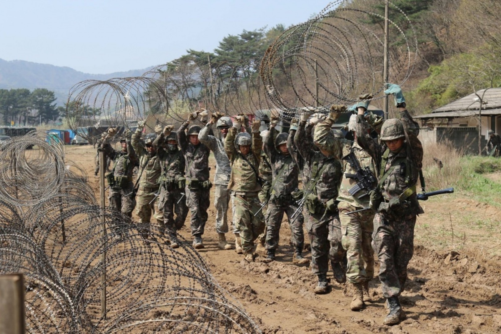 Soldiers from 2ID Sustainment Brigade and the Republic of Korea Army 2nd Logistics Support Command construct their field site, April 8, 2017, in preparation for a Combined Distribution Exercise near Pohang, South Korea. The CDEx is part of exercise Operation Pacific Reach '17 and aims to strengthen the U.S. and ROK partnership and interoperability.
